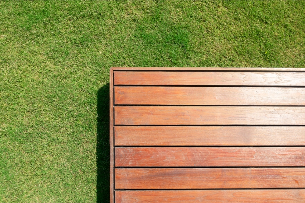 Do You Need To Remove Grass Under Decking? (And How To Remove It - Including Tarp)