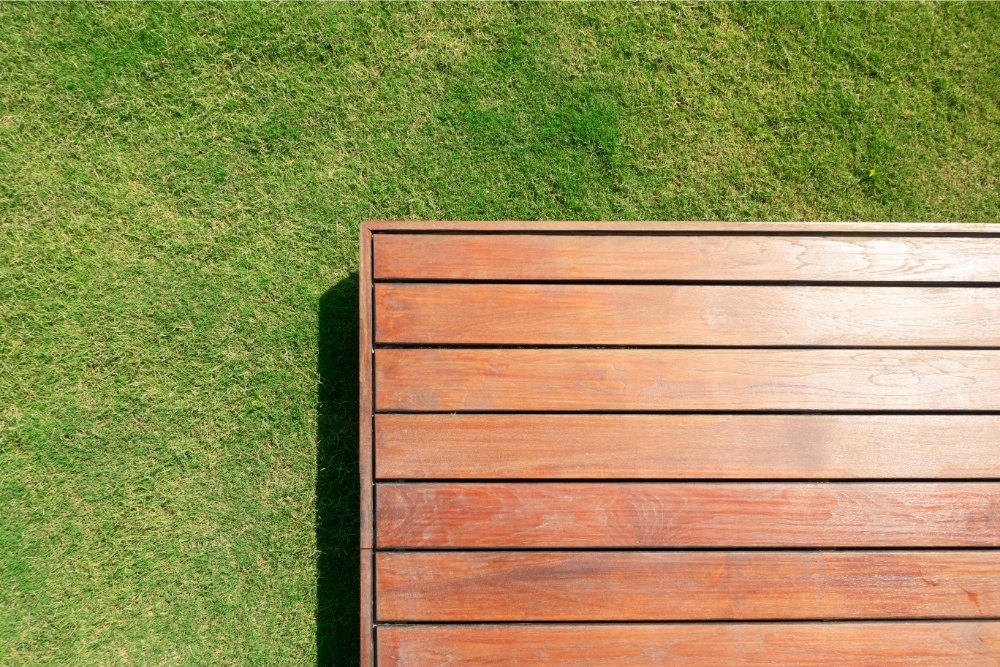 Do You Need To Remove Grass Under Decking (And How To Remove It - Including Tarp)