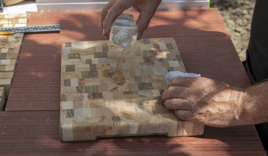 Apply the oil using a wood care swab to a food cutting board