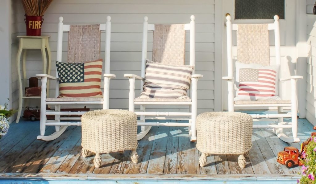 Fireman and patriotic themed worn wooden front porch in Cape