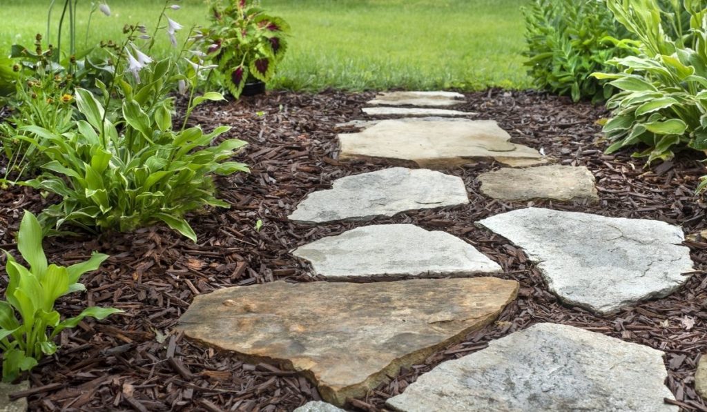 Residential garden walking path with flat stones 
