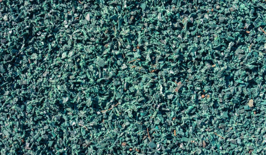 Shredded recycled rubber used on playground